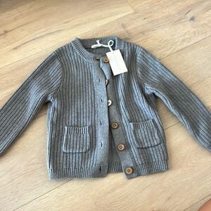 Jaime Kay cardigan features buttons down the front + two pockets.